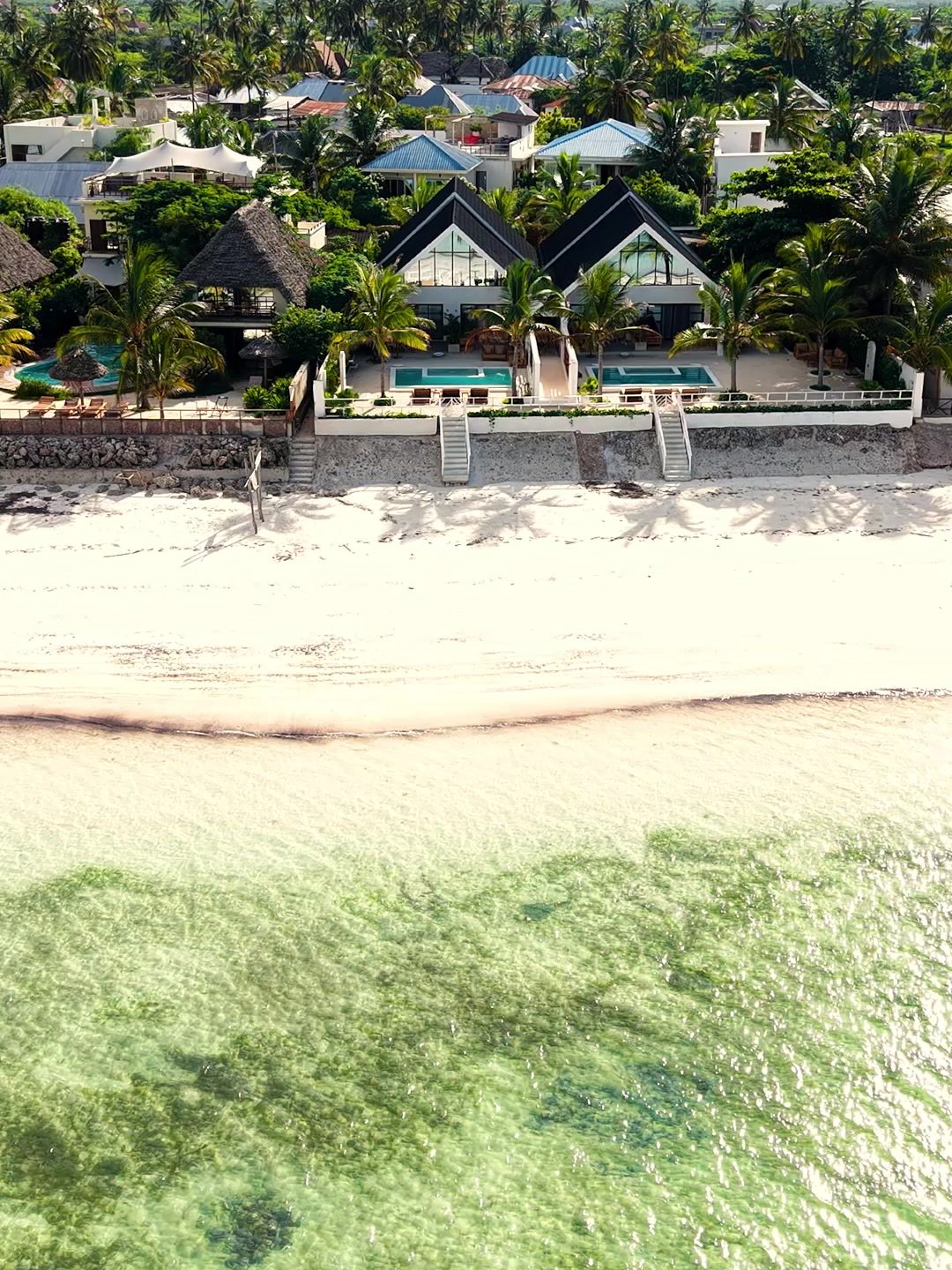 Drone view of Jambiani Beach and the Solymar villas with their pools