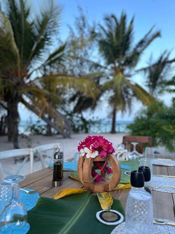 Breakfast table set in front of the ocean