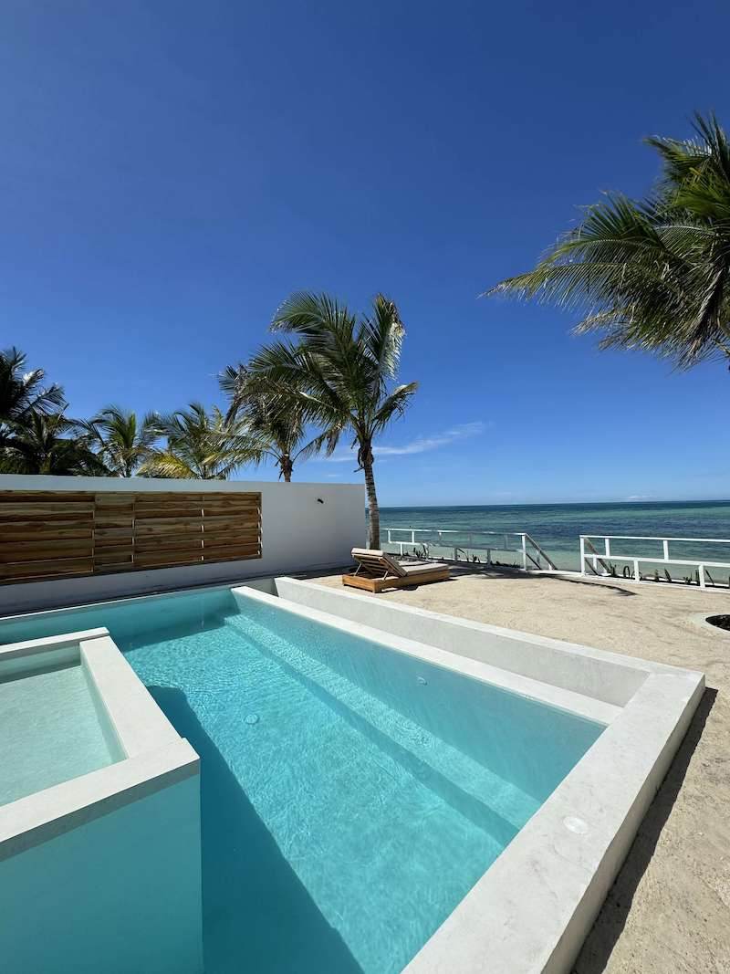 Private pool with the ocean behind it
