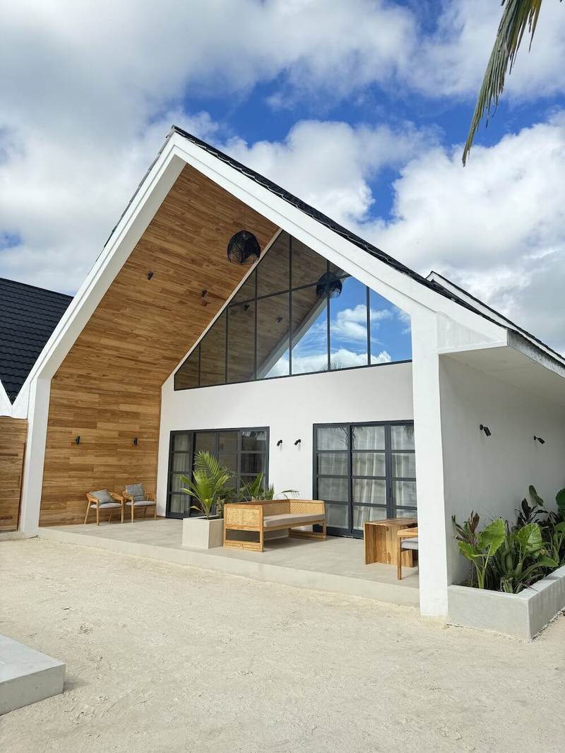 Villa 02, an A-frame beachfront villa with large windows in Jambiani